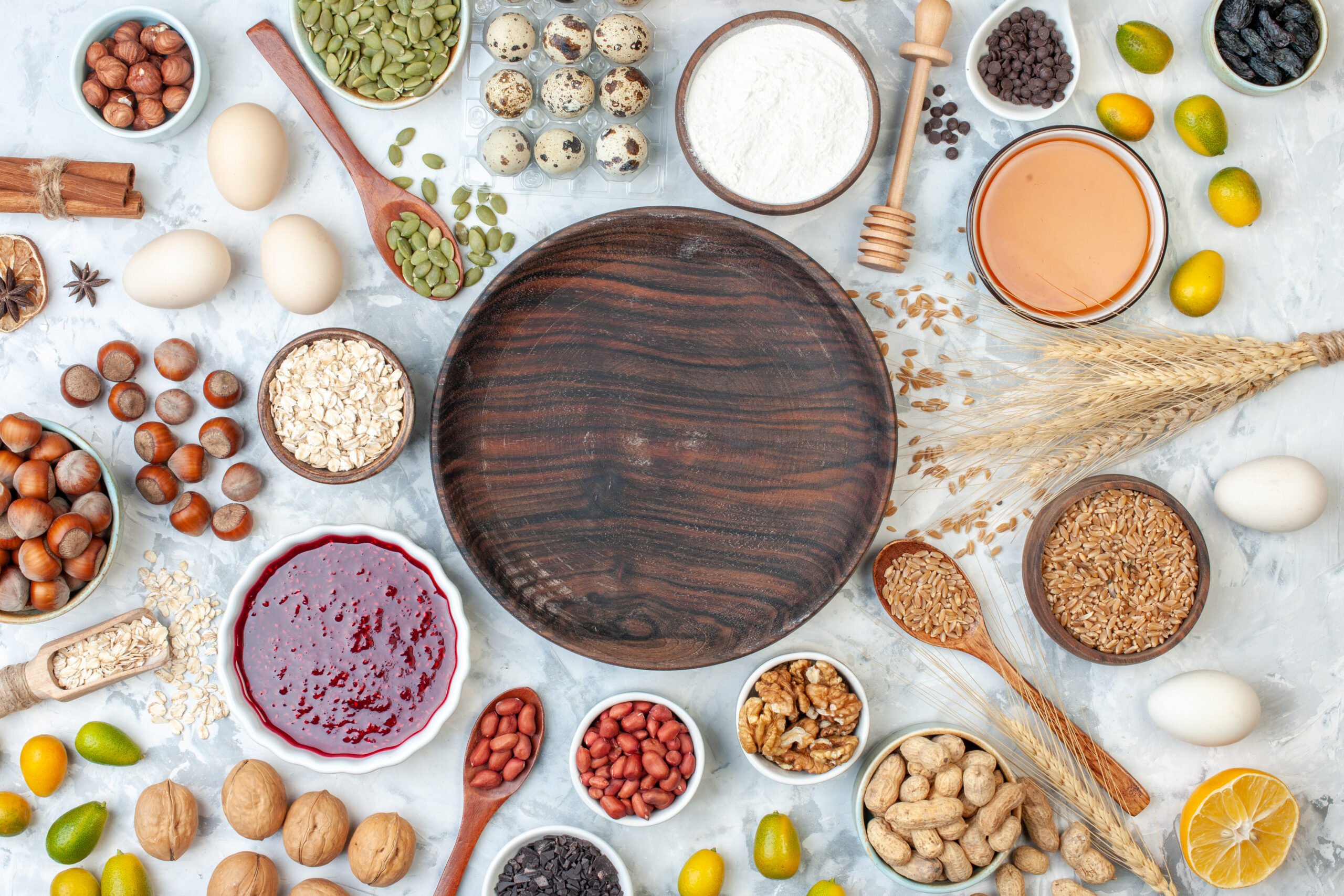 top-view-round-wooden-plate-with-jelly-eggs-different-nuts-seeds-white-dough-sugar-cake-sweet-color-biscuit-nut-photo